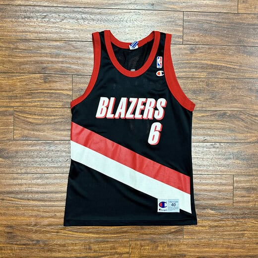 Front view of vintage Bonzi Wells Portland Trail Blazers Champion jersey with red and white diagonal stripe and number 6.